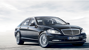 Mercedes-Benz S-Class Black Mercedes-Benz S-Class driving on the sand.